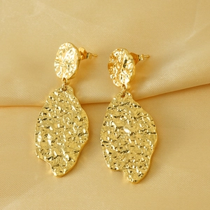 Irregular leaf stud earrings in gold titanium steel with textured hammer finish