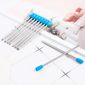 Pack of 10 metal blue ink ballpoint pen refills on grid paper background