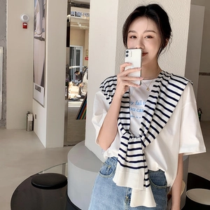 Striped knit shawl wrap paired with a white cotton t-shirt and light blue denim shorts