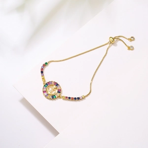 Adjustable 18K gold plated bracelet with colorful stones and a gold anchor charm