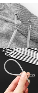 Flexibler Nadeleinfädler aus Metall zeigt hohe Elastizität und Anwendung auf Stoff