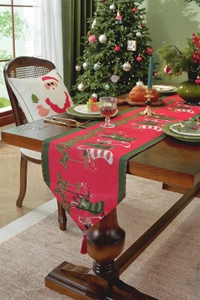 Detail of red and green Christmas table runner with festive jacquard patterns and tassels