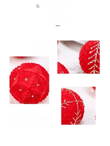 Close-up of red flocked Christmas balls with glitter snowflake patterns and small rhinestones