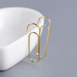 Minimalist S925 sterling silver safety pin earrings in a polished golden finish