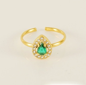 Detailed close-up of 18K gold sunflower ring featuring a green pear-cut zircon stone