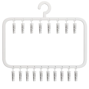 White multi-clip drying rack with 18 pegs for socks and laundry on white background