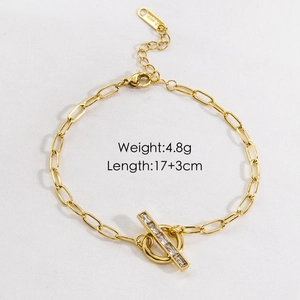 Detail of gold OT buckle bracelet with oval chain and sparkling cubic zirconia stones