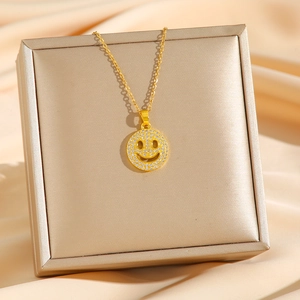 Hip-hop style gold smiling face pendant necklace with cubic zirconia on silk fabric