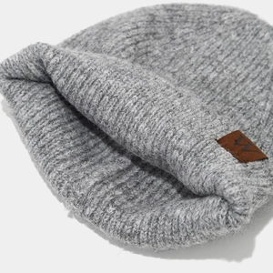 Winter striped knit beanie in grey ribbed fabric with a vintage brown leather patch