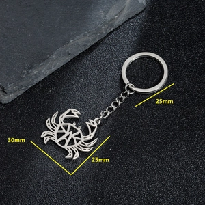 Minimalist hollow crab keychain in stainless steel with a geometric ocean design