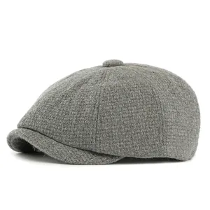Retro dark grey newsboy cap in textured wool blend fabric with classic stitched panels