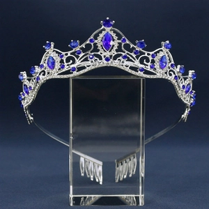 Elegant silver bridal crown featuring blue gemstones and sparkling clear rhinestones