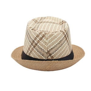 Close-up of the woven texture on a vintage Trilby straw hat with black decorative band
