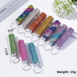 Close-up of 11cm rhinestone-encrusted 3-section pill bottle keychain with 2cm diameter