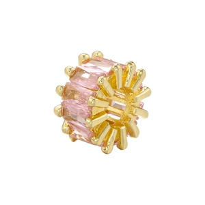 Detailed macro view of 18K gold-plated barrel bead with inlaid pink rectangular crystals