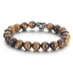 Tiger eye bead bracelet with silver steel skull cross charm on white background