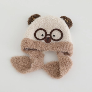 Close-up of kids plush bear hat with fleece texture and integrated earflap scarf