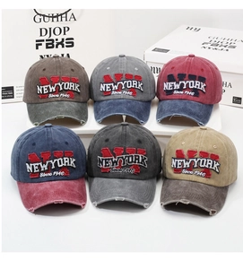 Detailed grid of distressed baseball caps with New York embroidery and washed finish
