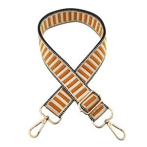 Adjustable woven bag strap with yellow and white stripes and gold metal hardware