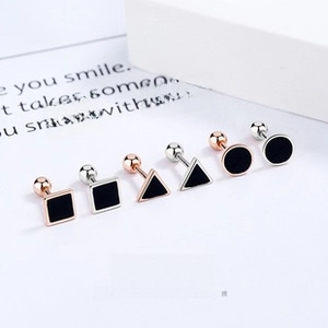 Detailed view of geometric drop glaze earrings with secure screw-on backings