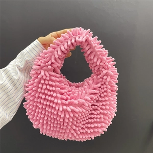 Close-up of pink chenille plush handbag featuring soft marshmallow texture and candy color