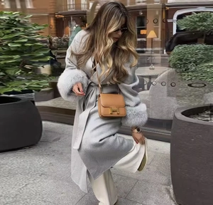 Grey long wool coat featuring luxurious faux fur cuffs and elegant waist tie belt