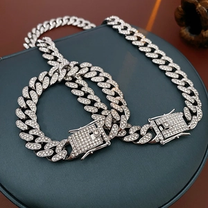 Macro shot of silver Cuban chain set with sparkling rhinestones on jewelry box lid