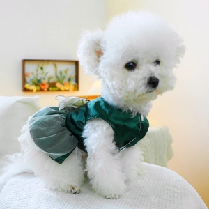 Close-up of the green satin bodice and white mesh layers on this pet princess dress