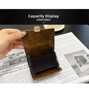 Detail view of brown multi-slot accordion card wallet with gold snap button closure