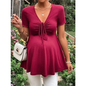 Detail of V-neck maternity top with drawstring chest design and ruffled short sleeves