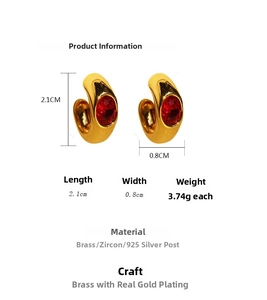 Detailed size and material view of gold-plated brass C-hoop earrings with red zircon stones