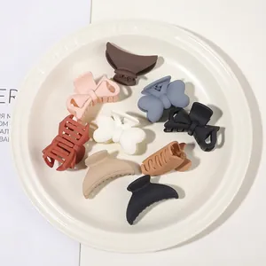 Set of 9 matte finish shark hair clips and bow claws in assorted earthy tones