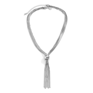 Detail of layered silver metal chains featuring a sphere pendant and tassel with extender