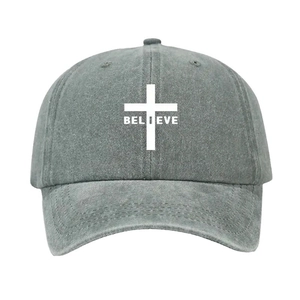 Front view of dark grey baseball cap with white cross and BELIEVE print on cotton fabric