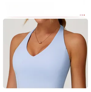 Detail view of light blue yoga vest with reinforced V-neck seams for enhanced support