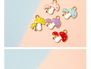 Detailed view of colorful enamel mushroom charms in pink, blue, yellow, purple, and red colors