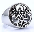 Macro shot of Viking Celtic knot pattern and vine engraving on vintage silver ring