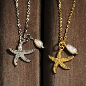 Close-up of starfish pendants in gold and silver finish with elegant white pearls