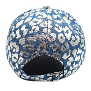 Detail of blue denim baseball cap with silver leopard print and adjustable metal buckle