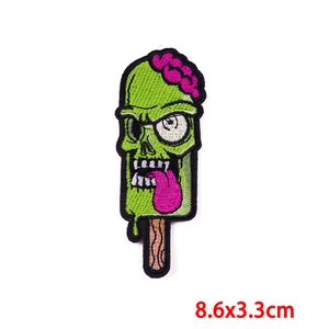 Detail of zombie popsicle embroidery patch with green and pink threads, 8.6x3.3cm size