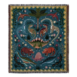 Bohemian dinosaur woven picnic blanket with tassels and navy blue prehistoric pattern
