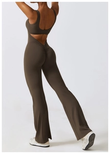 Detailed back view of deep olive yoga bodysuit featuring scrunch butt and flared leg cut
