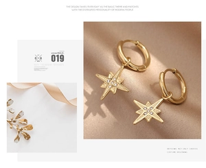 Detail of gold eight-point star hoop earrings with zircon pavé on champagne silk