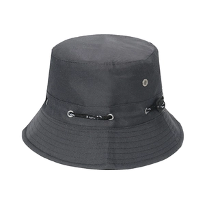 Detail of dark grey sun hat featuring silver metal eyelets and adjustable black drawstring