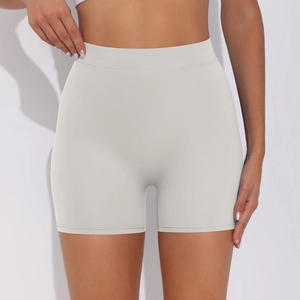 Detail showing high-waisted seamless peach lift scrunch yoga shorts in light grey fabric