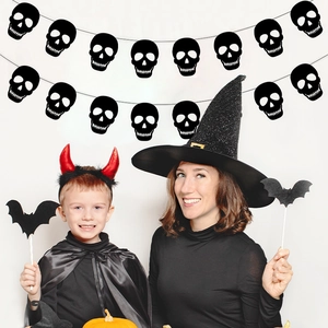 Halloween decoration set with skull banner, witch hat and bat props on white background