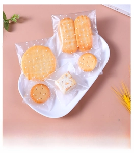 Close-up of frosted white polka dot self-adhesive snack bags with various cookies