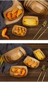 Macro shot showing multiple sizes of stacked brown kraft paper food trays on a table