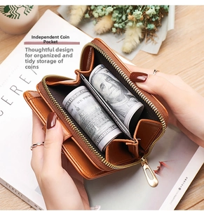 Detail of the brown accordion coin pocket showing large internal storage for cash