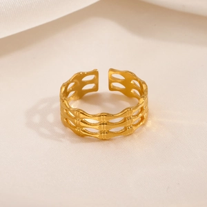 Adjustable golden hollow bamboo texture geometric ring in minimalist metallic style